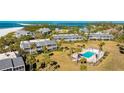 Well-maintained condo complex with a sparkling pool and lush tropical landscaping at 7155 Gulf Of Mexico Dr # 22, Longboat Key, FL 34228
