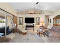 Bright living room with vaulted ceilings, comfortable seating, and a decorative sailboat collection on display at 1577 Taggard Rd, North Port, FL 34288