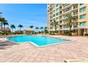 Inviting pool area with lounge chairs and a gazebo, perfect for relaxation and entertainment at 130 Riviera Dunes Way # 1104, Palmetto, FL 34221