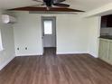 Bright living room with wood floors and a ceiling fan at 2601 Gulf N Dr # 510, Bradenton Beach, FL 34217
