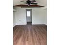 Bright living room with wood floors and a ceiling fan at 2601 Gulf N Dr # 510, Bradenton Beach, FL 34217
