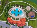 Stunning aerial view showcasing the community pool, playground, and clubhouse at 5447 Tripoli Dr, Palmetto, FL 34221
