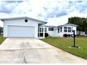 Charming single-story home with a two-car garage and well-maintained landscaping at 8435 Regal Way, Palmetto, FL 34221