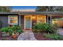 Charming home featuring a beautifully landscaped front yard and inviting front door at 2264 Floyd St, Sarasota, FL 34239