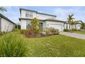 Beautiful two-story home with a manicured lawn and two car garage at 12409 Wigeon Dr, Bradenton, FL 34212