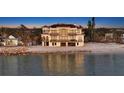 Stunning waterfront property with multiple balconies and direct beach access at 3625 Casey Key Rd, Nokomis, FL 34275