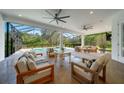 Inviting screened patio area with comfortable seating options and a view of the sparkling pool at 14901 17Th E Ave, Bradenton, FL 34212