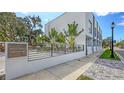 Modern townhomes with sleek design, lush landscaping, and street view at 1774 10Th St, Sarasota, FL 34236