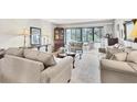 Inviting living room with large windows, neutral colors, and comfortable seating for relaxation at 542 Lakeside Dr # 542, Bradenton, FL 34210
