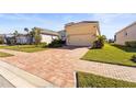 Inviting single Gathering home featuring a well maintained yard and beautiful brick driveway at 6247 Champions Row St, Bradenton, FL 34210