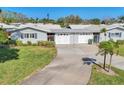 Inviting single-story home with well-manicured lawn, attached garage, and a charming, secure gated entrance at 7304 11Th W Ave, Bradenton, FL 34209