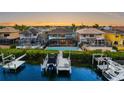 A waterfront property boasts a backyard pool, dock, and boat lift with convenient access to the water at 1215 Acappella Ln, Apollo Beach, FL 33572