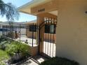 The front entrance has a decorative wrought iron gate and brick walkway at 9400 Ridge Rd, Seminole, FL 33772