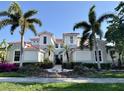 Charming two-story home with a red tile roof, featuring meticulously landscaped grounds at 9606 Sea Turtle Ter # 101, Bradenton, FL 34212