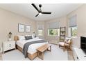 Cozy bedroom with a large bed, modern decor, and lots of natural light at 1825 Bayshore Dr, Terra Ceia, FL 34250