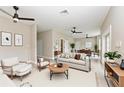 Inviting living room with neutral tones, stylish furnishings, and an open floor plan to dining area at 1825 Bayshore Dr, Terra Ceia, FL 34250
