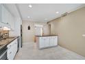 Bright kitchen with white cabinets and granite countertops at 304 Pine Run Dr, Osprey, FL 34229