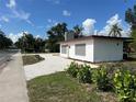 Exterior view of a modern home with white gravel landscaping and minimalist design at 4122 N Lockwood Ridge Rd, Sarasota, FL 34234
