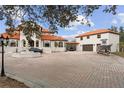 Elegant Mediterranean home with a fountain, covered parking and a separate garage for boat storage at 1450 Bern Creek Loop, Sarasota, FL 34240