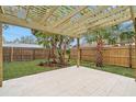 Expansive backyard features a pergola-covered patio, perfect for outdoor entertaining and relaxation at 4536 1St N Ave, St Petersburg, FL 33713