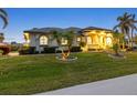 Charming one-story home with manicured landscaping and palm trees at 3607 Darin Dr, Punta Gorda, FL 33950