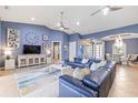 Spacious living room features soaring ceilings, tile floors, and a modern color palette at 3607 Darin Dr, Punta Gorda, FL 33950