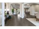 Inviting foyer with tile floors leading to open-concept living spaces and featuring high ceilings and stylish décor at 5203 Lake Overlook Ave, Bradenton, FL 34208