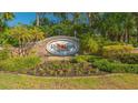 Red Hawk Reserve community sign surrounded by manicured landscaping and lush greenery at 6630 Horned Owl Pl, Sarasota, FL 34241