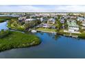 Waterfront home with private dock, lush greenery, and convenient access to bay at 7056 Hawks Harbor Cir, Bradenton, FL 34207