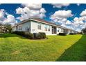 Expansive backyard features lush green lawn and well-maintained landscaping at 11728 Meadowgate Pl, Bradenton, FL 34211