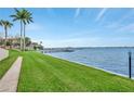 Waterfront condo with dock and lush green grass to the water at 1600 1St W Ave # 304A, Bradenton, FL 34205