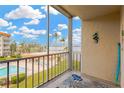Balcony view overlooking pool area and beautiful open water views in the distance at 1600 1St W Ave # 304A, Bradenton, FL 34205