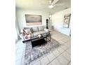 Cozy living room featuring a comfortable sofa, stylish rug, and modern décor at 4444 Los Rios St, North Port, FL 34287