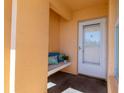 Inviting front porch with a cozy built-in bench and seating area at 4570 Pinebrook Cir # 303, Bradenton, FL 34209