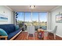 Bright living room featuring a sliding glass door and scenic water views at 4570 Pinebrook Cir # 303, Bradenton, FL 34209