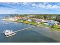 Beautiful waterfront homes with docks and lush landscaping line the shoreline at 7416 Riverview Dr, Bradenton, FL 34209