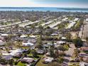 An aerial view shows the property's location within a well-established residential neighborhood by the bay at 807 62Nd W St, Bradenton, FL 34209