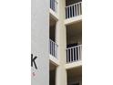 A side view of the building featuring multiple balconies with white railings at 3756 Lake Bayshore # 509, Bradenton, FL 34205