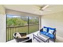 Relaxing screened balcony featuring comfortable seating and scenic views at 6705 Grand Estuary Trl # 201, Bradenton, FL 34212
