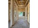 Spacious interior view showcasing the construction framework, open layout, and natural light at 19591 Fort King Run, Brooksville, FL 34601