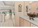 Welcoming foyer with tile floors and a glimpse of the living room and outdoor view at 4714 Potomac Cir, Bradenton, FL 34210