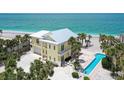 Stunning beach house with a metal roof, a pool, and beautiful beach access at 777 N Manasota Key Rd, Englewood, FL 34223