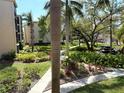 Beautifully landscaped grounds with lush foliage, flowers, and walkways at 515 30Th W Ave # H207, Bradenton, FL 34205