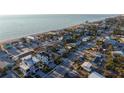 Coastal home boasts breathtaking ocean views and convenient beach access, nestled among lush tropical landscaping and neighborhood streets at 1214 Gulf Blvd, Englewood, FL 34223