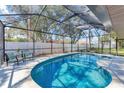 Inviting screened-in pool area with clear blue water and comfortable seating at 1219 Sleepy Hollow Rd, Venice, FL 34285