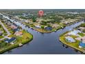 Waterfront homes nestled within a vibrant community, boasting private docks and lush landscaping at 4363 Melis St, Port Charlotte, FL 33948