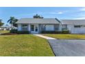Inviting single-story villa showcasing a well-maintained lawn and walkway to the front door at 3701 39Th W St, Bradenton, FL 34205