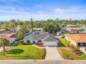 An aerial view of a beautifully landscaped ranch-style home in a lush, green neighborhood at 7507 3Rd Nw Ave, Bradenton, FL 34209