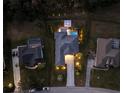 Stunning aerial view of a backyard with a luxurious pool, spa, and well-lit patio area perfect for relaxation and entertaining at 3407 155Th E Ave, Parrish, FL 34219