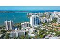 Panoramic aerial view of bayfront condos, city skyline, and picturesque waterfront in desirable neighborhood at 435 S Gulfstream Ave # 1004, Sarasota, FL 34236